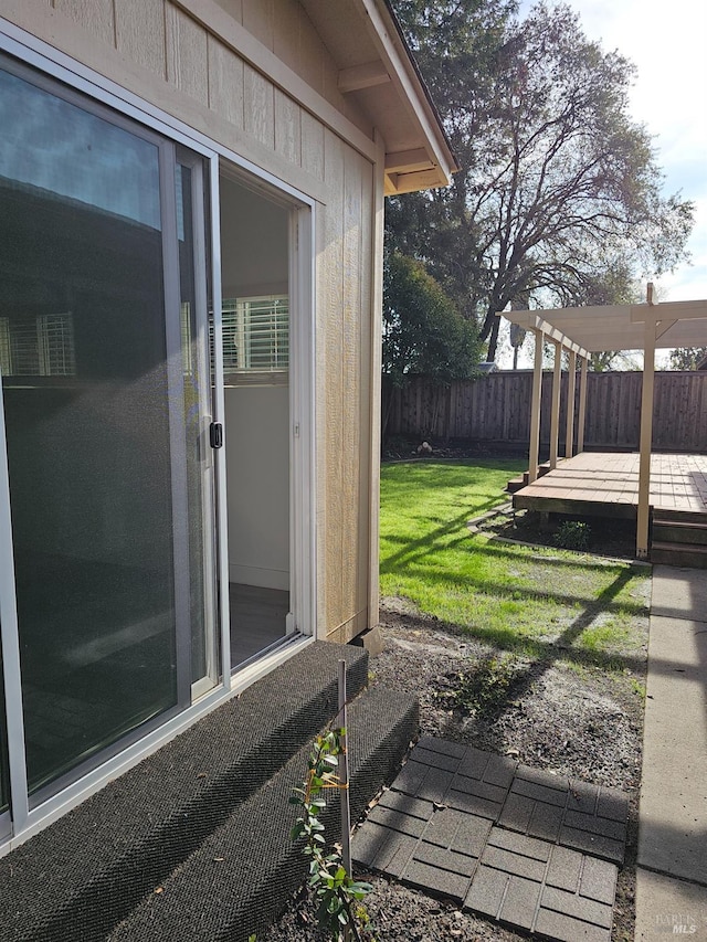 view of yard with a pergola and a deck