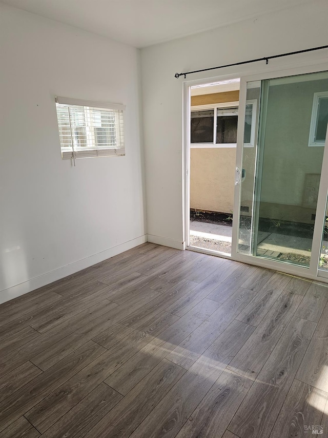 empty room with wood-type flooring