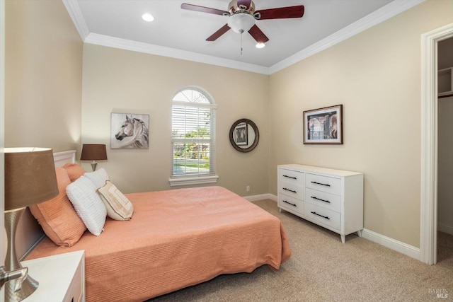 carpeted bedroom featuring ceiling fan and ornamental molding