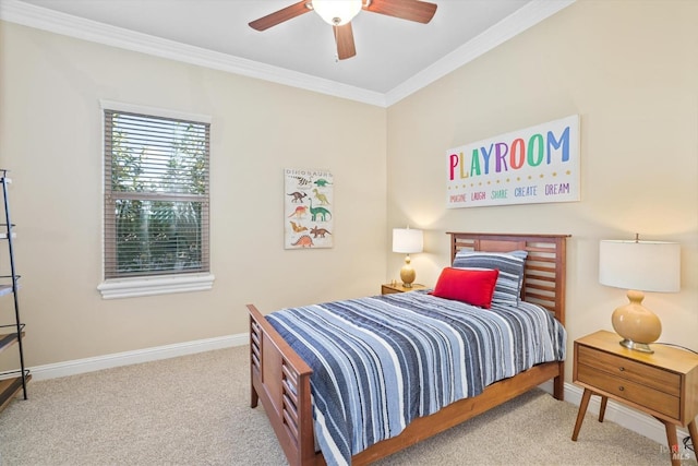 carpeted bedroom with ceiling fan and ornamental molding