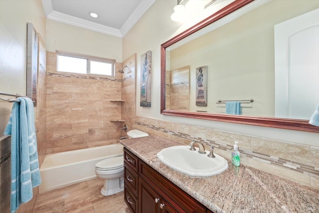 full bathroom with decorative backsplash, ornamental molding, vanity, tiled shower / bath combo, and toilet