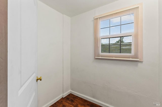 empty room featuring dark hardwood / wood-style floors