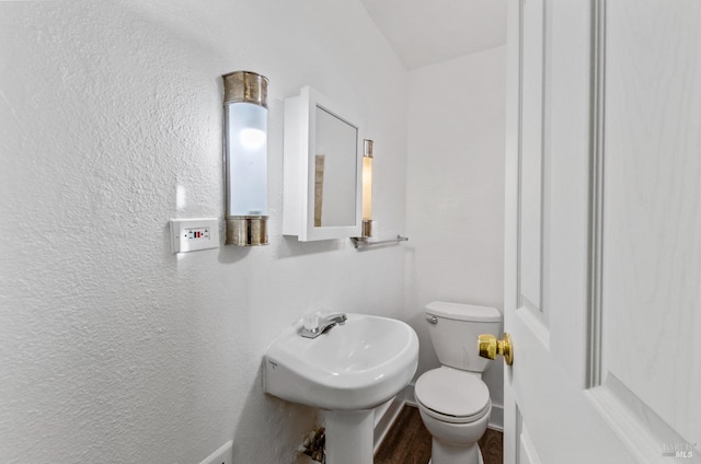 bathroom with sink and toilet