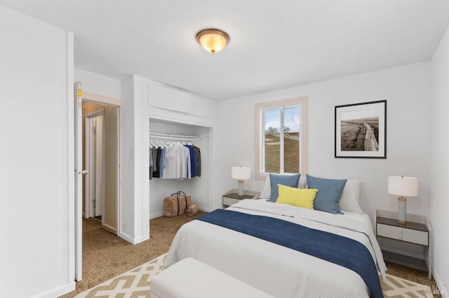 bedroom with light colored carpet and a closet