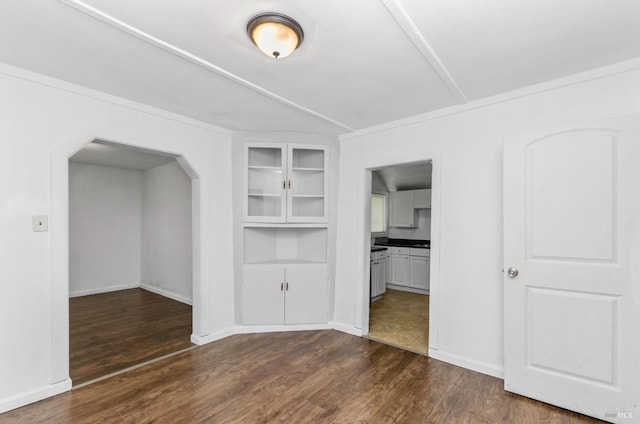 interior space with connected bathroom and dark hardwood / wood-style floors