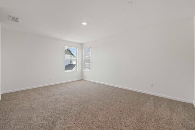 unfurnished room with carpet floors