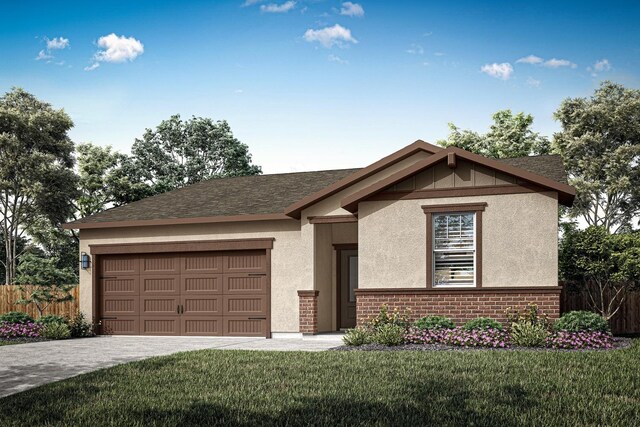 view of front of home with a garage and a front lawn