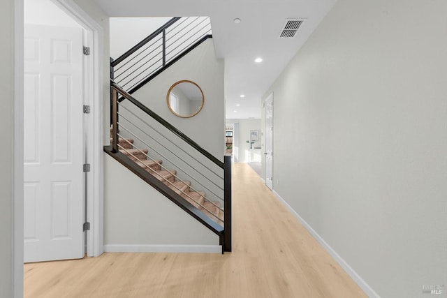 interior space featuring recessed lighting, visible vents, baseboards, and wood finished floors