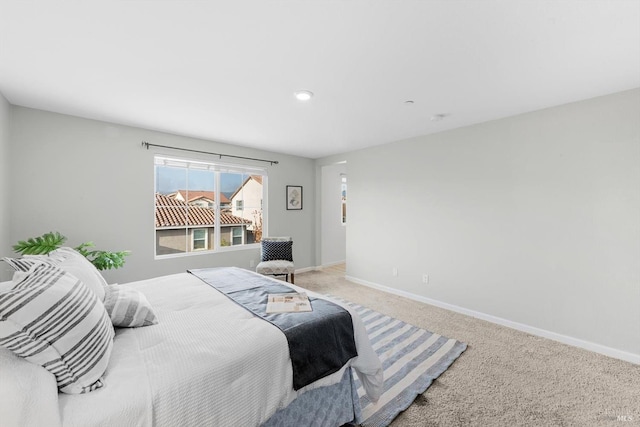 bedroom with carpet and baseboards