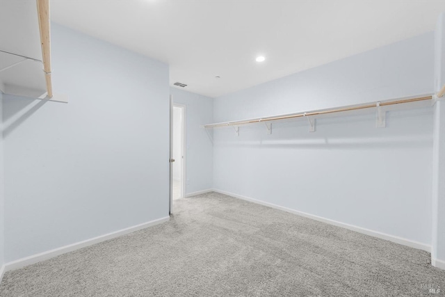 spacious closet with visible vents and carpet flooring