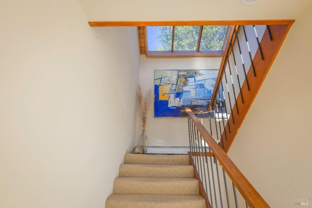 stairway featuring baseboard heating