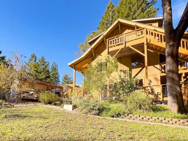 view of side of home with a deck