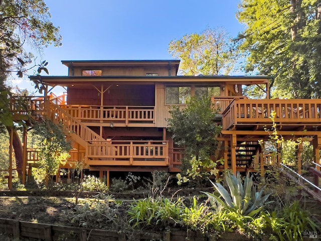 rear view of property with a deck