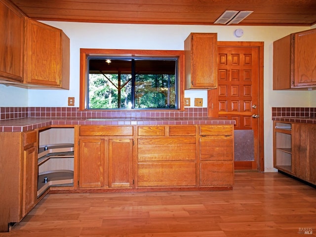 kitchen with light hardwood / wood-style floors and wood ceiling