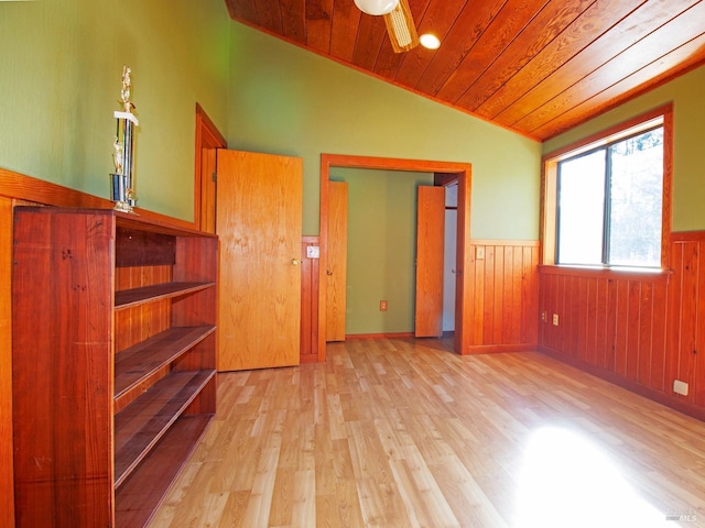 interior space with lofted ceiling, light hardwood / wood-style flooring, ceiling fan, and wooden ceiling