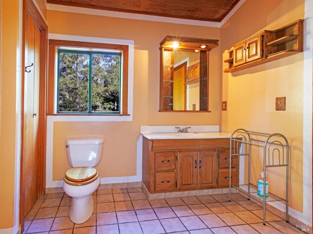 bathroom with tile patterned flooring, vanity, and toilet