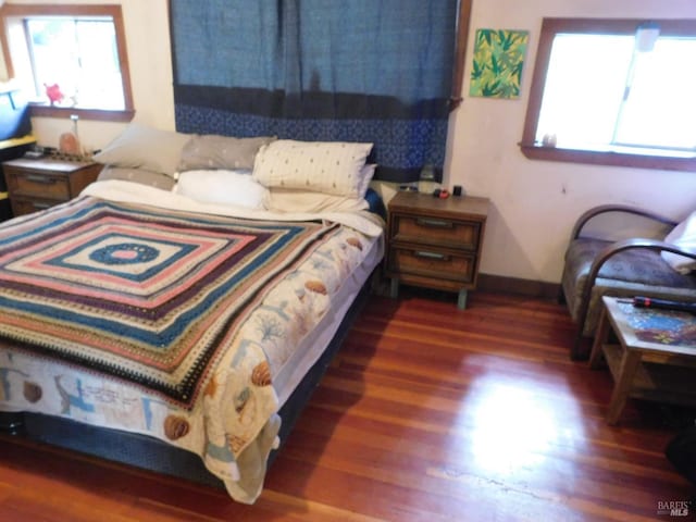 bedroom featuring dark wood-type flooring