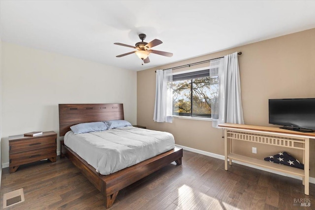 bedroom featuring ceiling fan and dark hardwood / wood-style floors