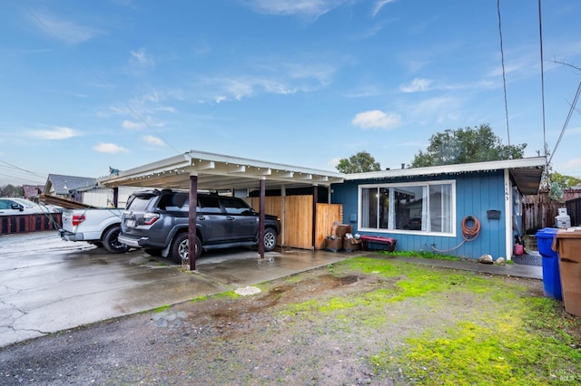 single story home featuring a carport