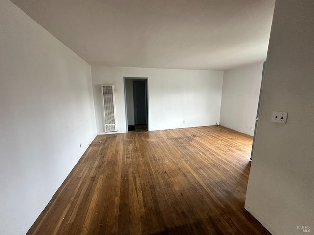 spare room with hardwood / wood-style floors