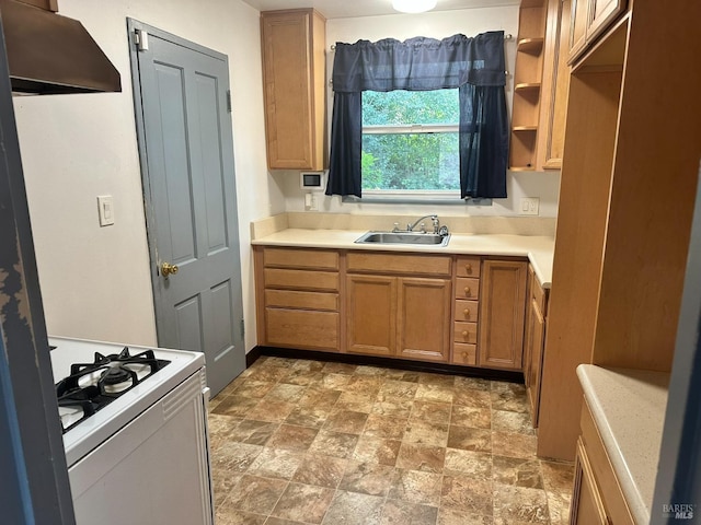 kitchen featuring white range with gas cooktop and sink