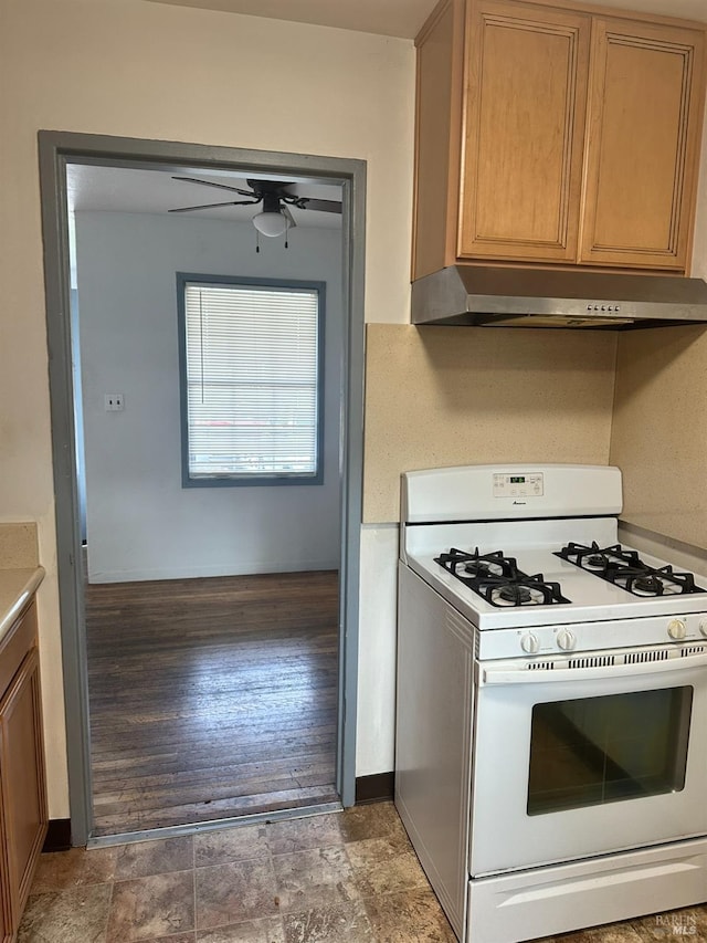 kitchen with ceiling fan, hardwood / wood-style floors, and white range with gas stovetop