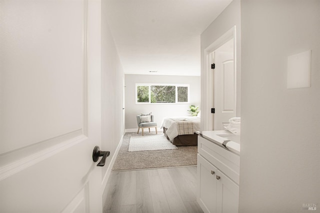 bathroom featuring visible vents, baseboards, and wood finished floors