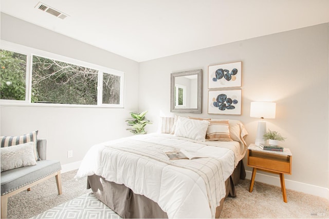 bedroom featuring carpet, visible vents, and baseboards