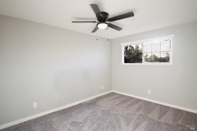 empty room featuring carpet floors, baseboards, and a ceiling fan