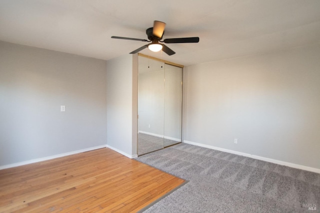 unfurnished bedroom with a ceiling fan, baseboards, and a closet