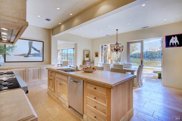 kitchen featuring sink, pendant lighting, light brown cabinets, dishwasher, and an island with sink