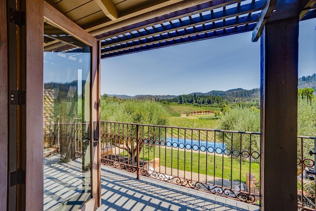 balcony with a pergola and a rural view