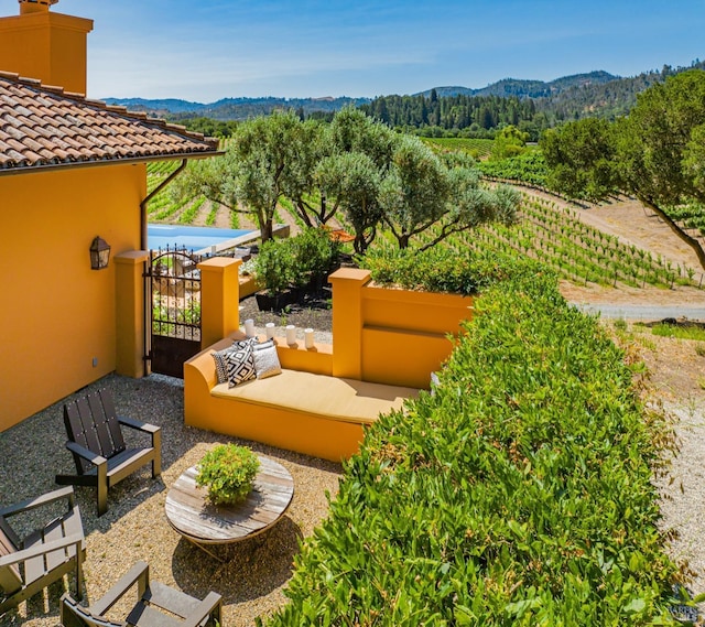 view of patio / terrace featuring a mountain view and an outdoor living space