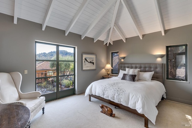 bedroom featuring carpet flooring, vaulted ceiling with beams, and access to outside