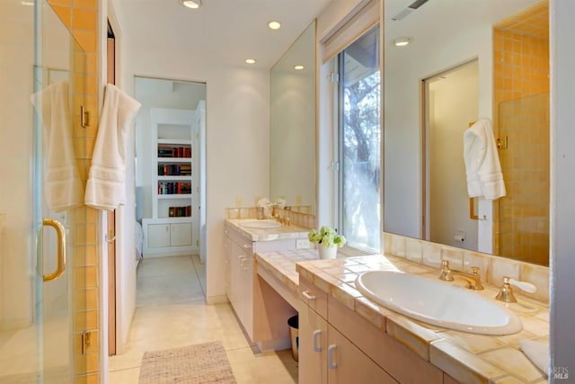 bathroom featuring tile patterned floors, vanity, and an enclosed shower