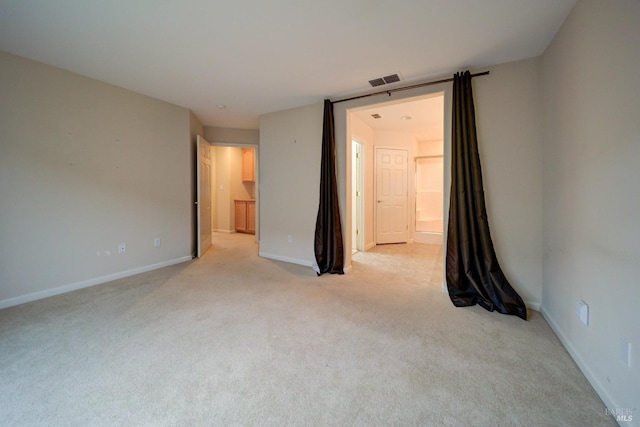 spare room with light colored carpet