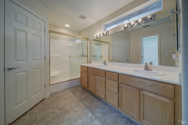 bathroom featuring vanity and walk in shower