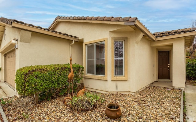 view of side of home featuring a garage