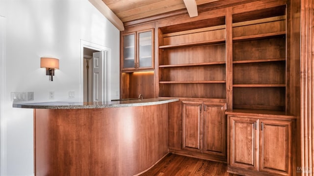 bar featuring dark wood-type flooring and wooden ceiling