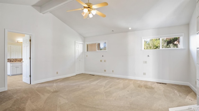 carpeted spare room with vaulted ceiling with beams and ceiling fan