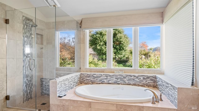 bathroom with separate shower and tub