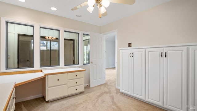 bathroom with ceiling fan and vanity