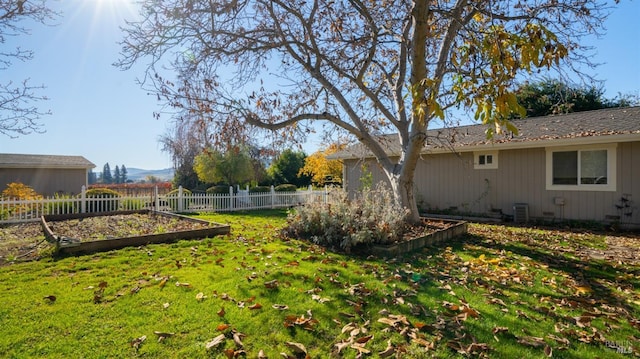 view of yard featuring central air condition unit