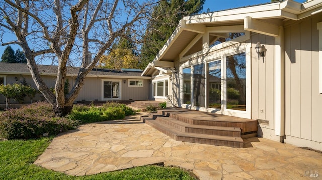 back of property with a patio area