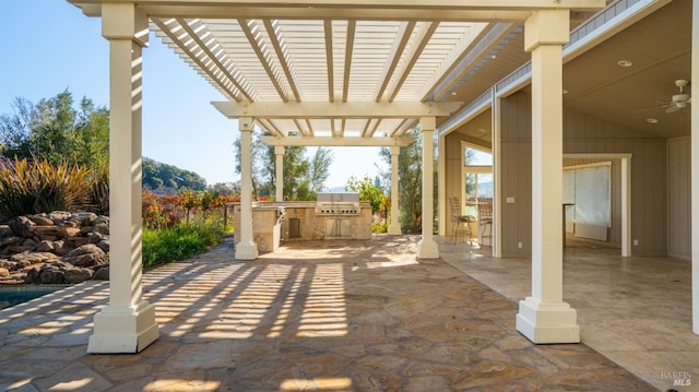 view of patio / terrace with a pergola, grilling area, ceiling fan, and an outdoor kitchen