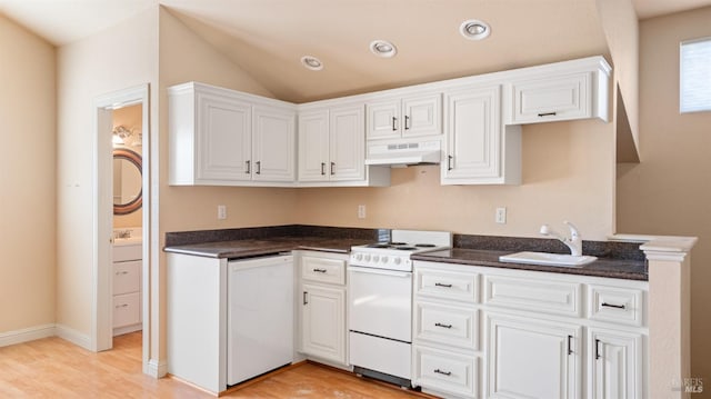 kitchen with sink, white cabinets, white appliances, and light wood-type flooring