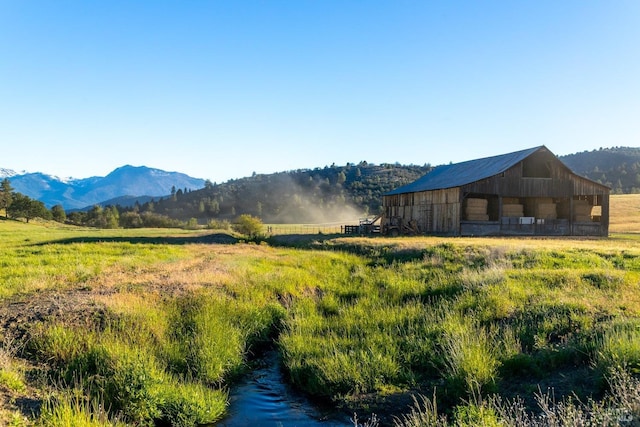 property view of mountains featuring a rural view