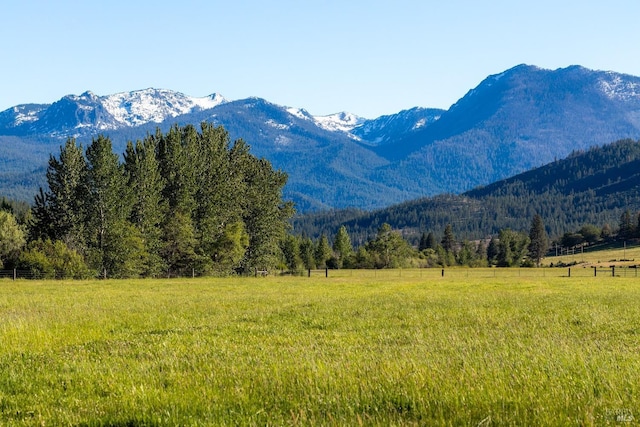 mountain view featuring a rural view