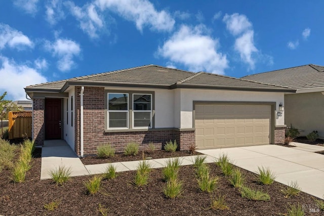 prairie-style house featuring a garage