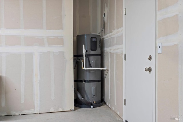 utility room featuring strapped water heater